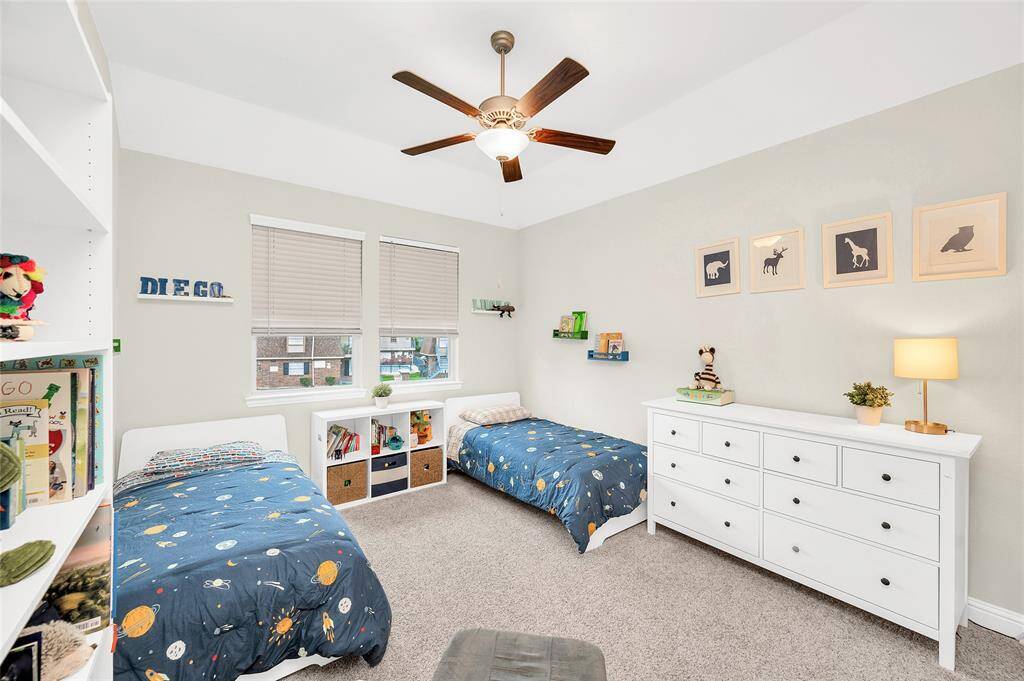 Generously sized second bedroom on the second floor, offering plenty of closet space and versatility for any need.