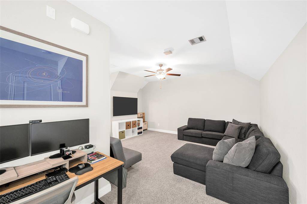 Versatile third-floor game/flex room with its own office nook and a full bathroom—perfect for guests, remote work, or private relaxation.