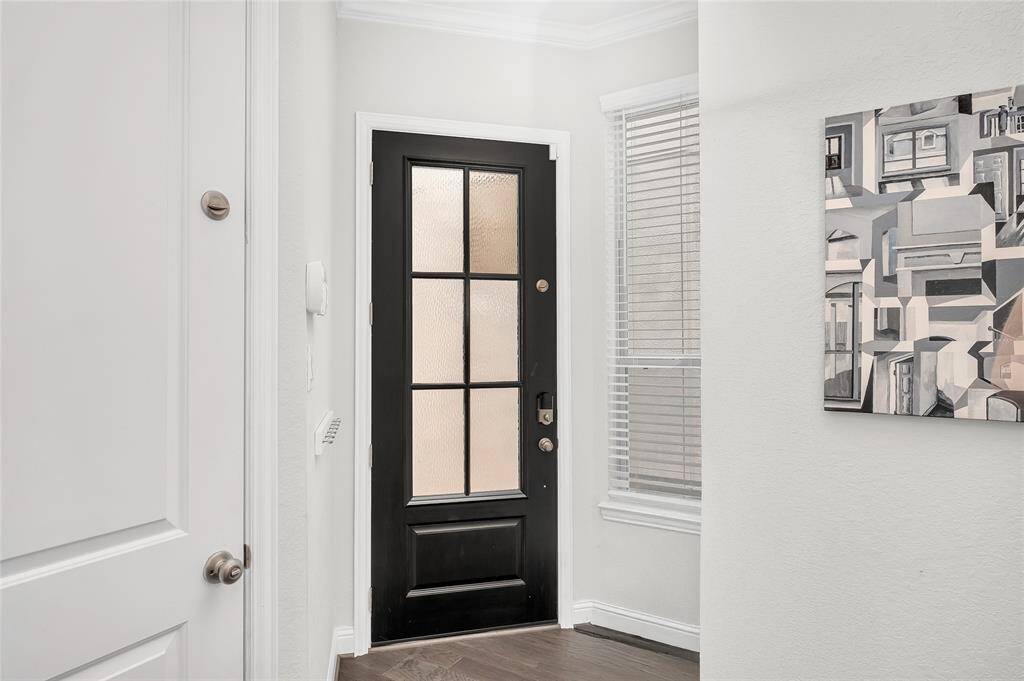 Foyer View with lots of natural light and welcoming Mohawk Hardwood Flooring.