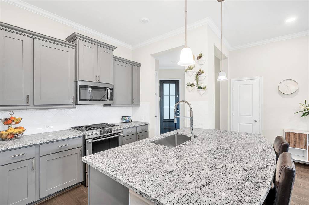 Modern stainless steel appliances (refrigerator not included).