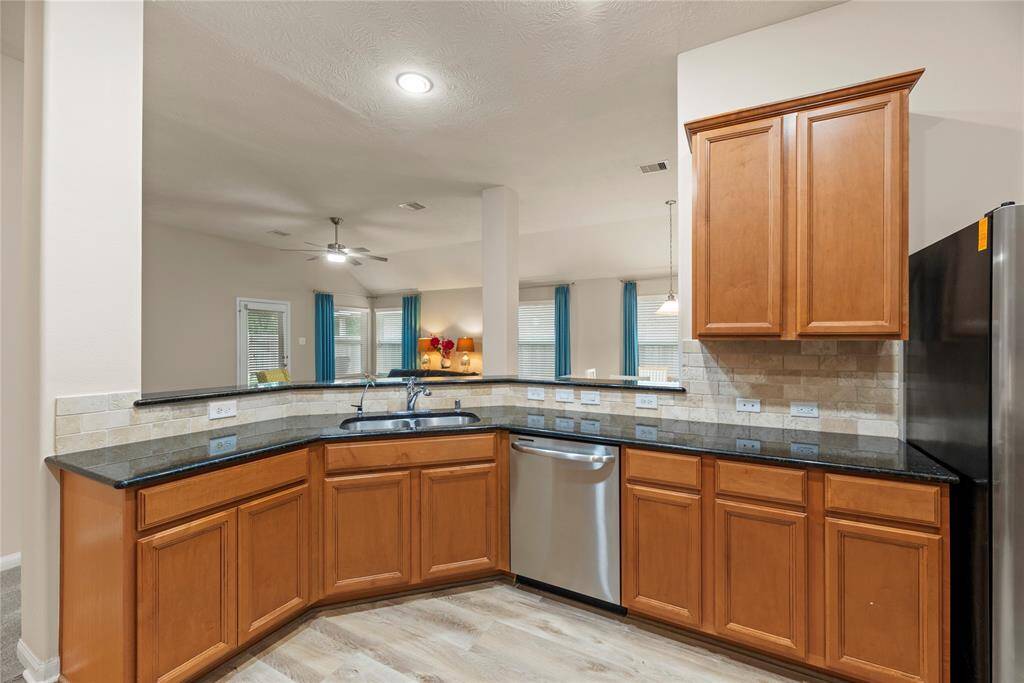 The kitchen also features a large breakfast bar and is open to the family room.
