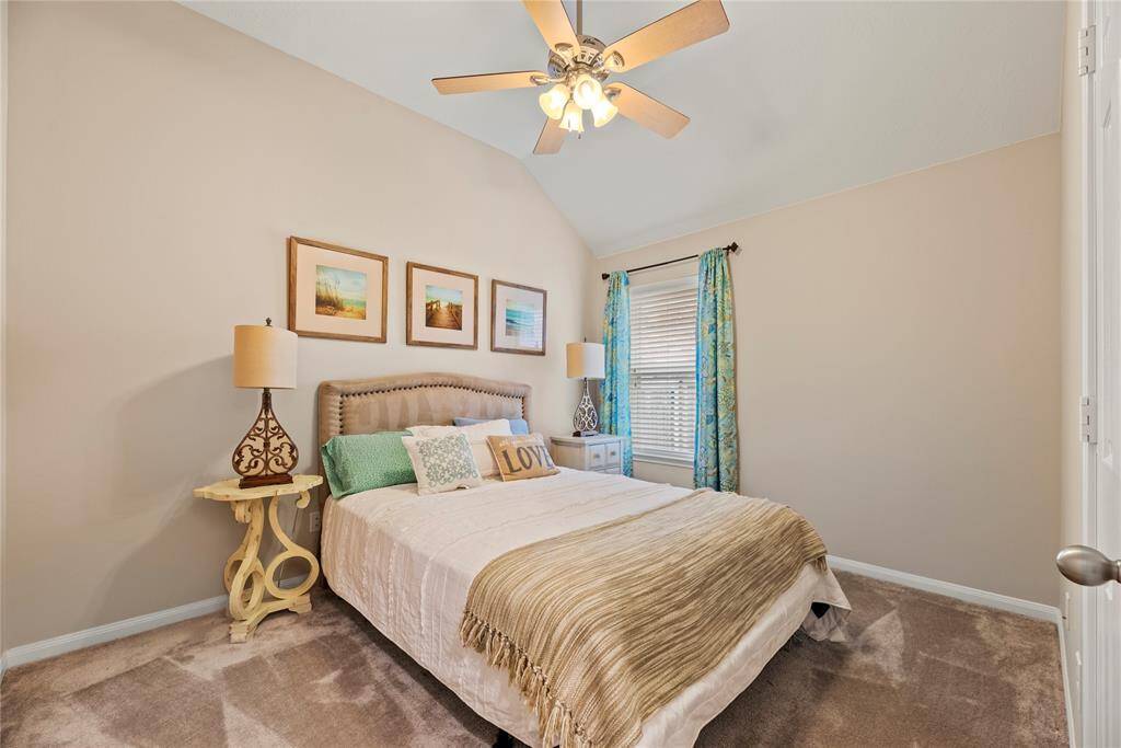 All secondary bedrooms offer plush carpet, ceiling fans and walk-in closets.