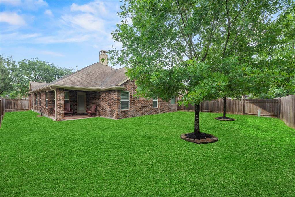 Private backyard with a covered patio.
