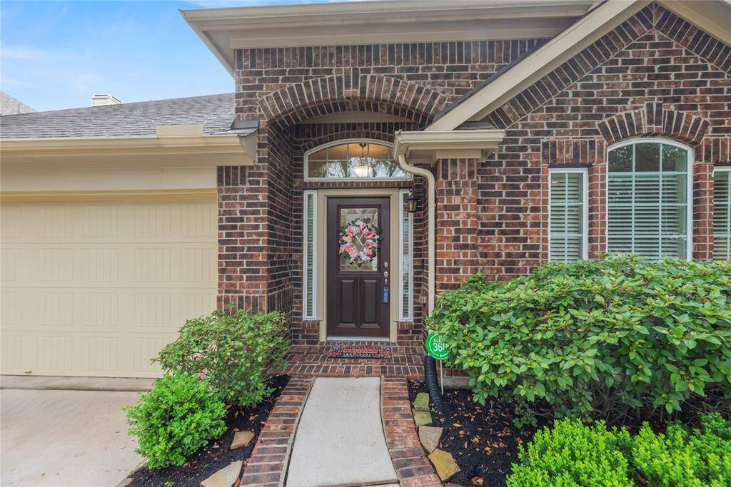 Lovely brick elevation and lush landscaping create great curb appeal.