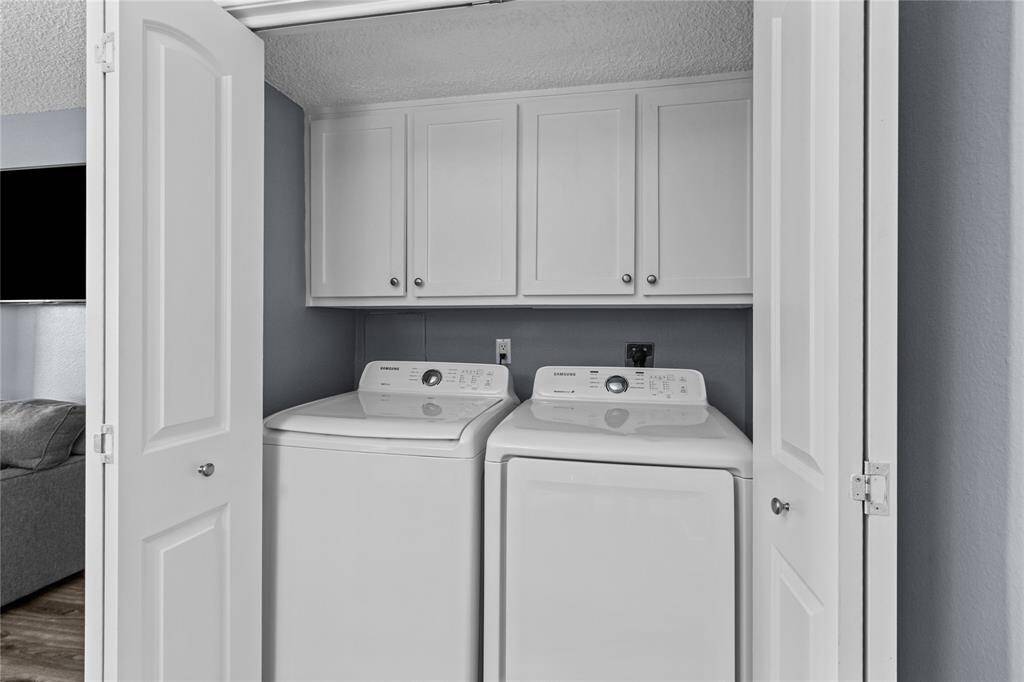 Full size washer/dryer and cabinets too.