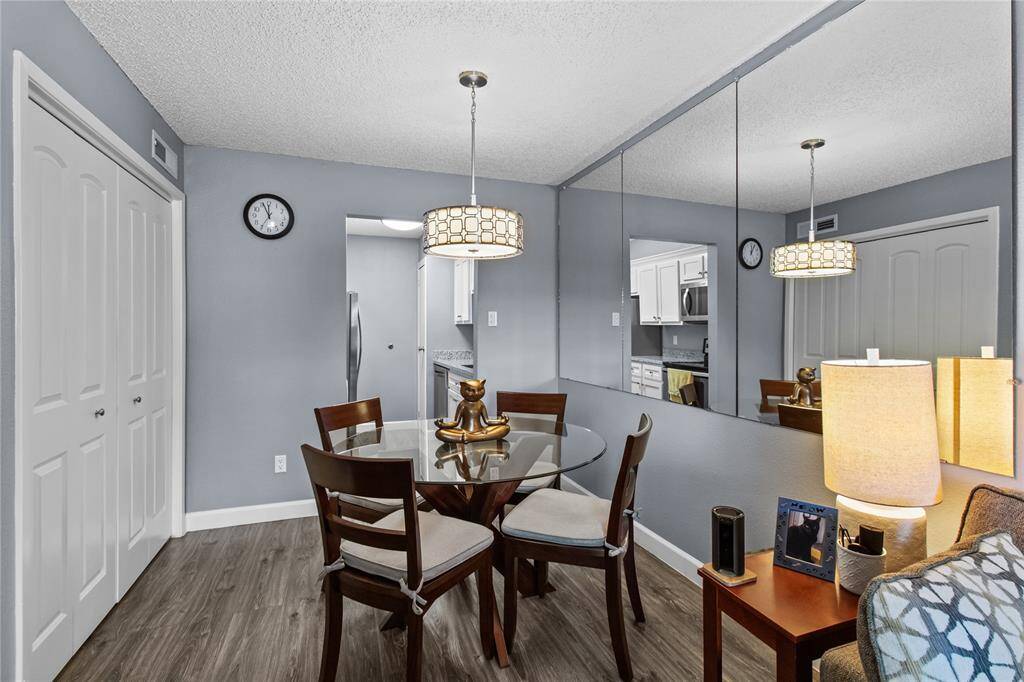 Another view of dining area, the closet on the left is where the included full size washer/dryer are located.