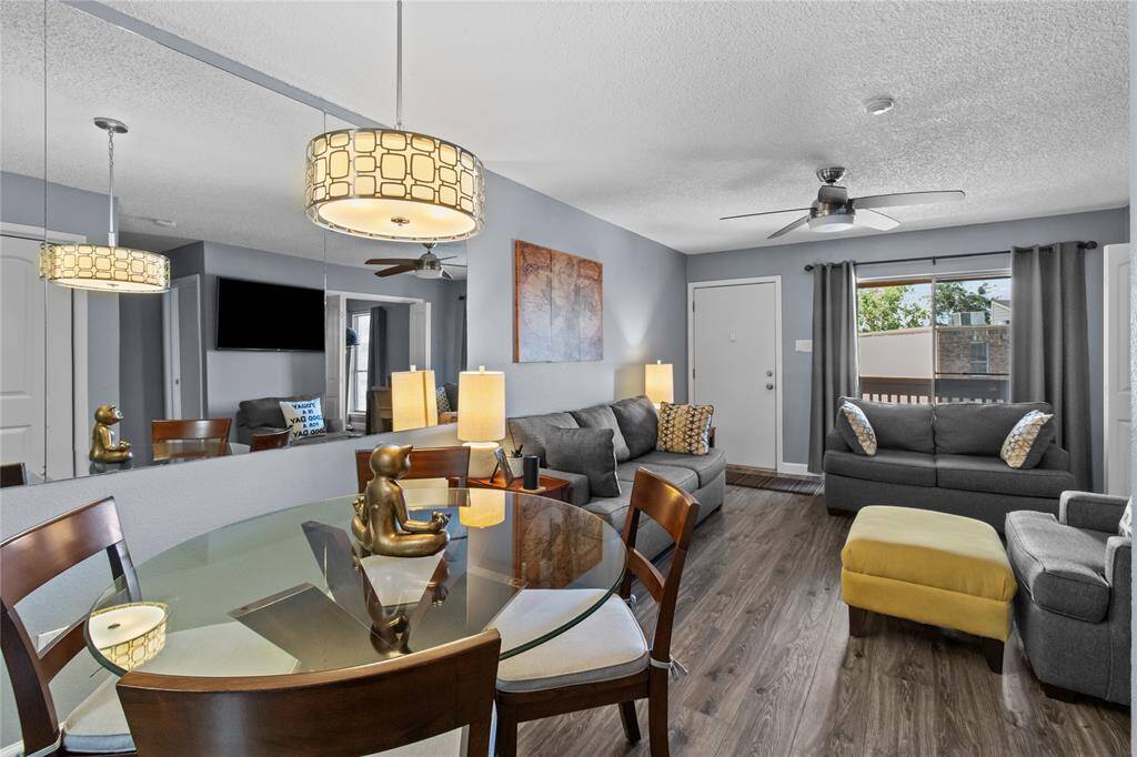 View from dining area toward living room and private balcony.