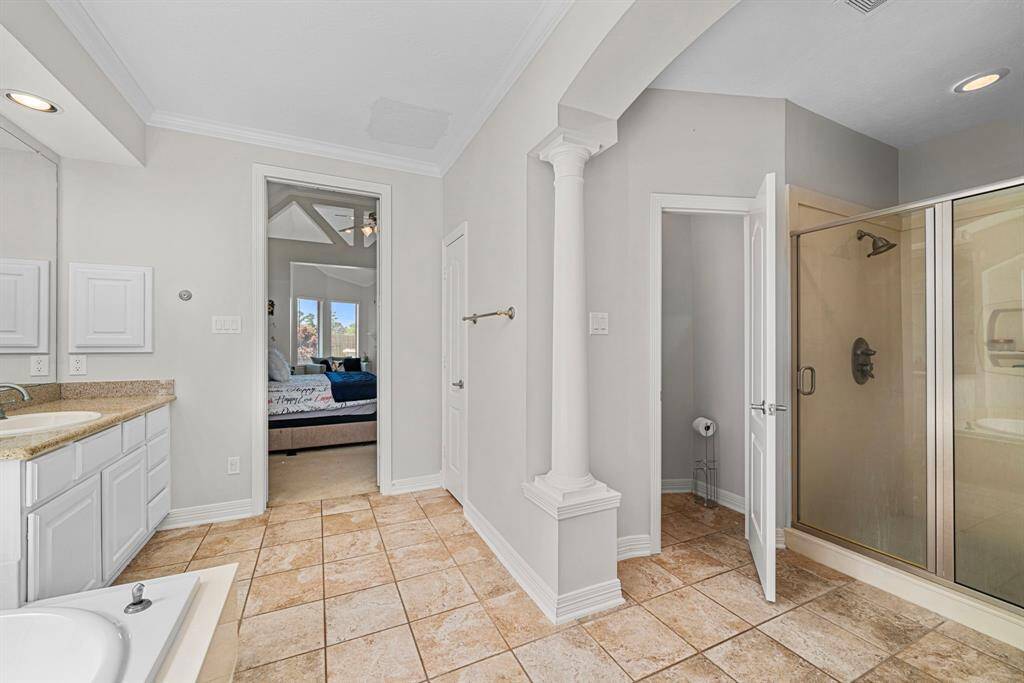 Luxury designed Primary Bathroom equipped inviting walk-in shower