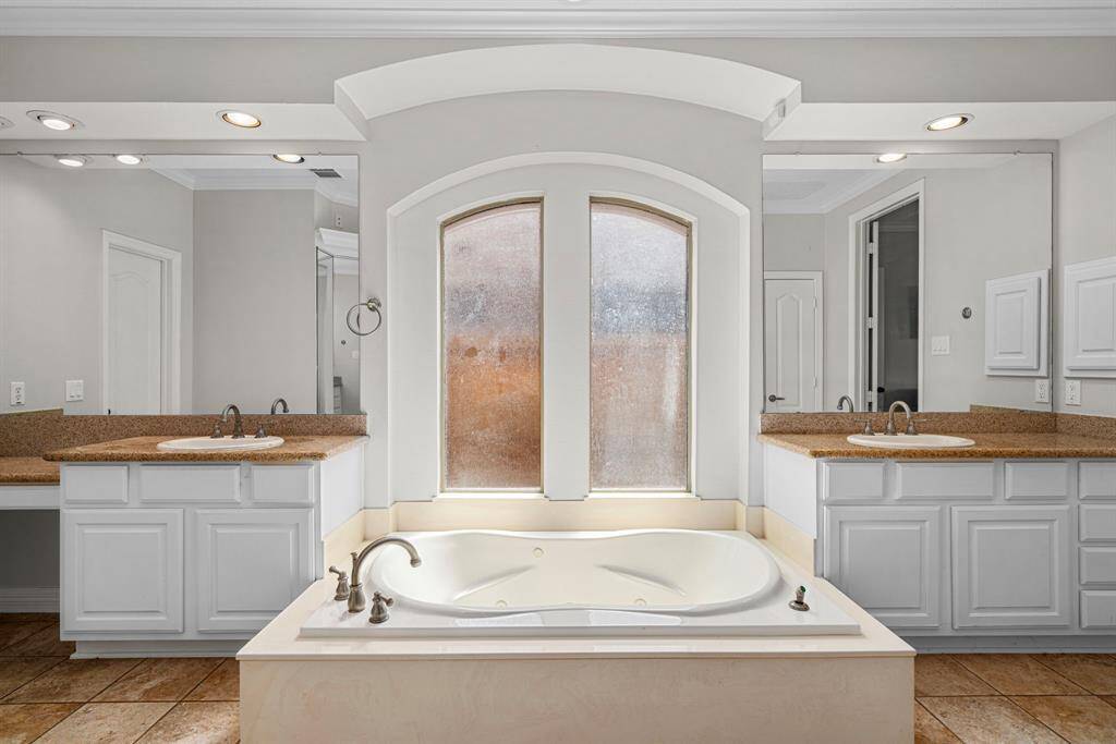 Primary Bathroom's Hot Tub & ever inviting natural lighting