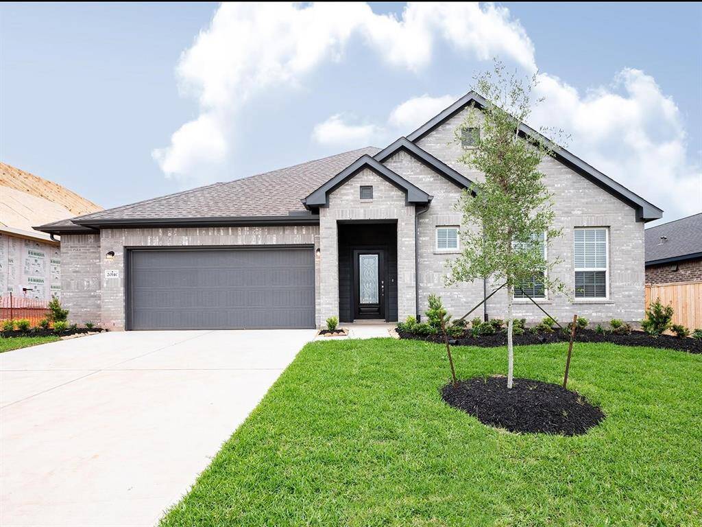 Beautiful front elevation shows the covered entry area.