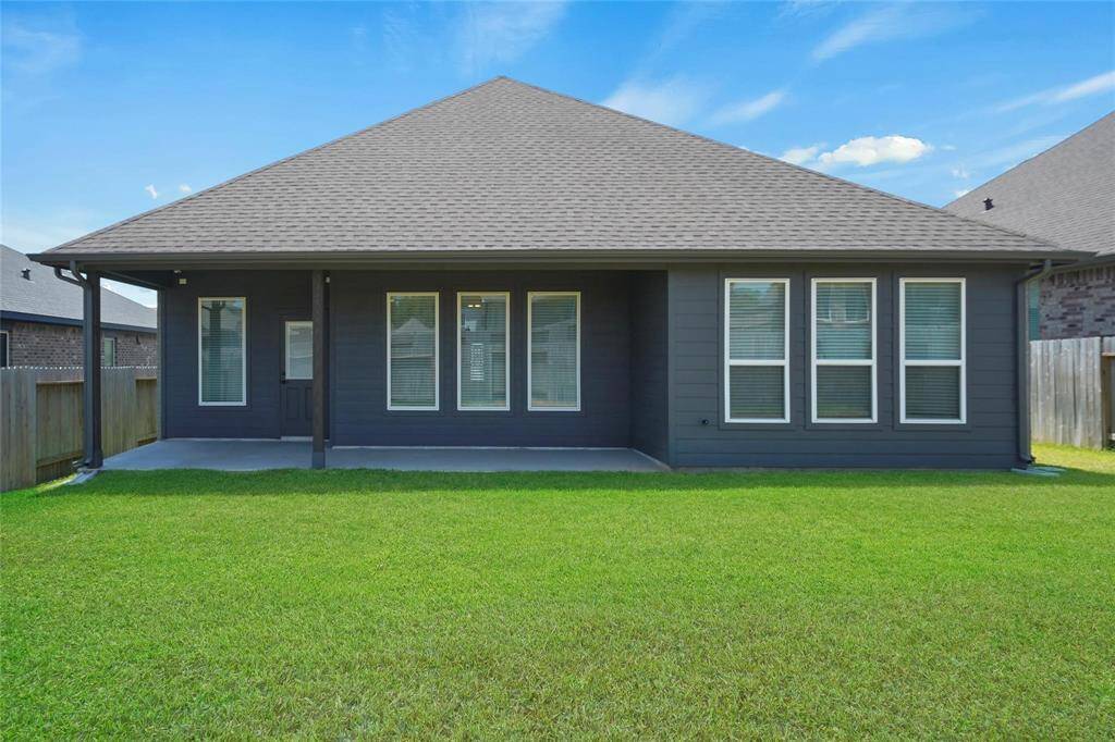 Huge backyard with covered back patio (27x6).  Great place to grill and hangout with the family!!
