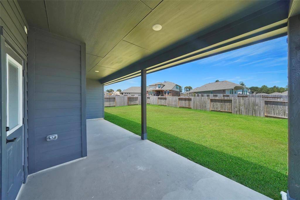 Another picture of huge back patio. Tons of space for patio furniture.