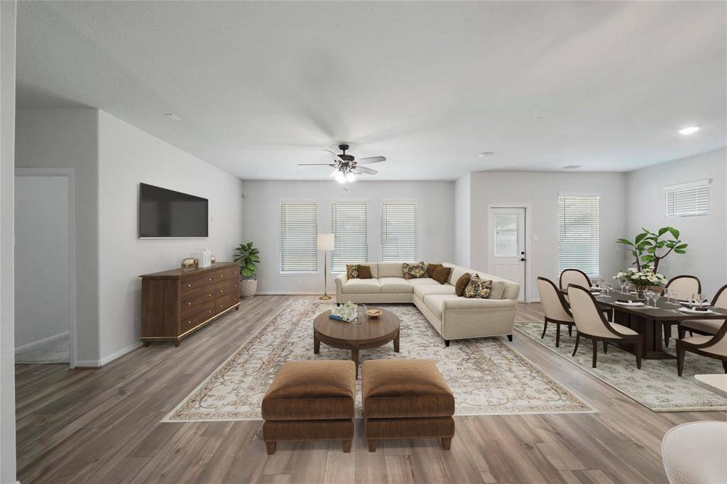 Spacious, open floor plan. This picture shows the dining & the den.Virtually Staged.