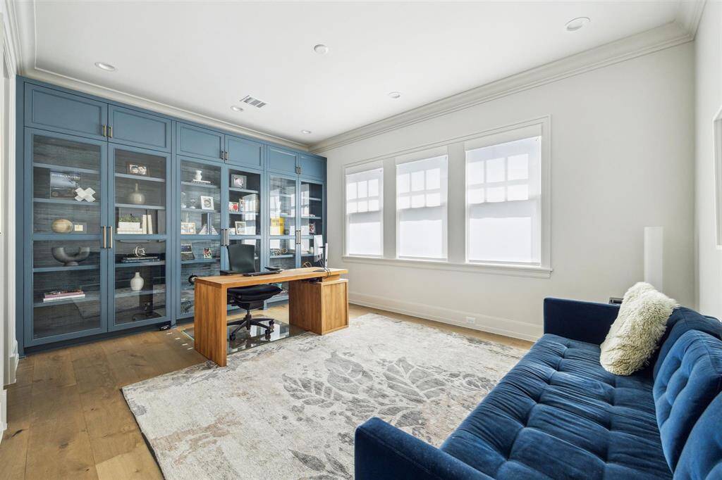 Versatile and filled with natural light, this oversized secondary bedroom with en-suite is designed for both comfort and functionality. Floor-to-ceiling built-ins add character and maximize storage, making it an ideal option for a spacious home office or creative workspace.