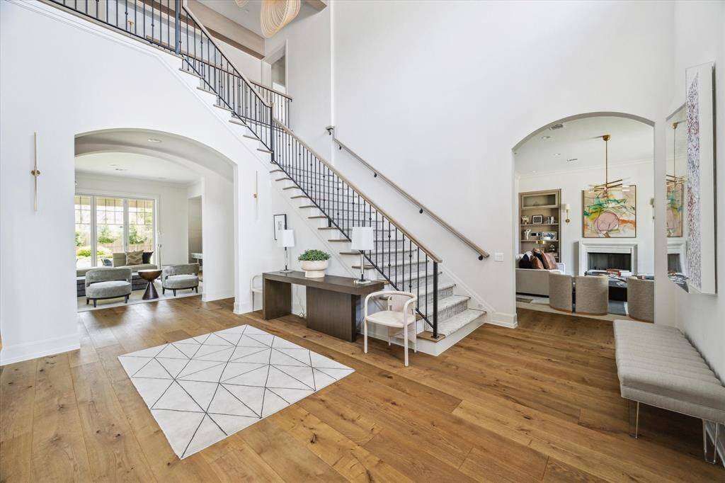 Every corner of this home showcases exquisite detailing, from the rich wood beams to the beautifully crafted flooring. Abundant natural light enhances the elegant design, creating a warm and inviting ambiance throughout.