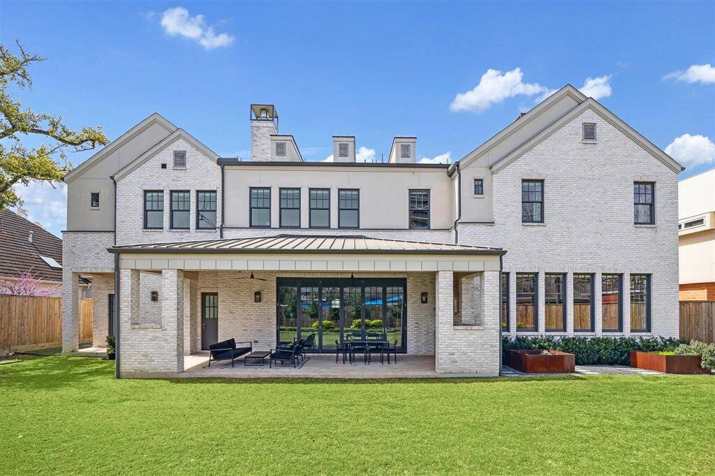 This stunning Oak Estates home boasts a covered outdoor pavilion perfect for entertaining, seamlessly extending into a lush backyard. Thoughtfully designed with professional landscaping and raised garden beds, the outdoor space offers both beauty and functionality in a serene setting.