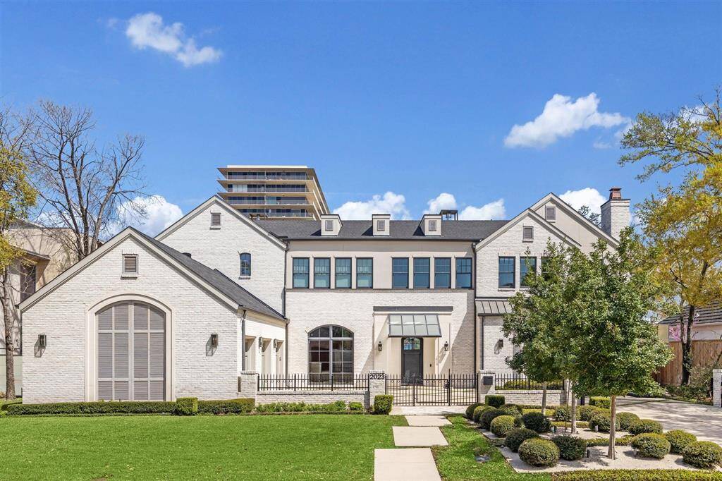 Situated on a premier lot in Oak Estates, this exceptional home is a true standout. A gated motor court leads to the attached three-car garage, setting the tone for the home's thoughtful design and flawless craftsmanship. Every detail at 2023 Drexel Drive has been meticulously executed to achieve perfection.