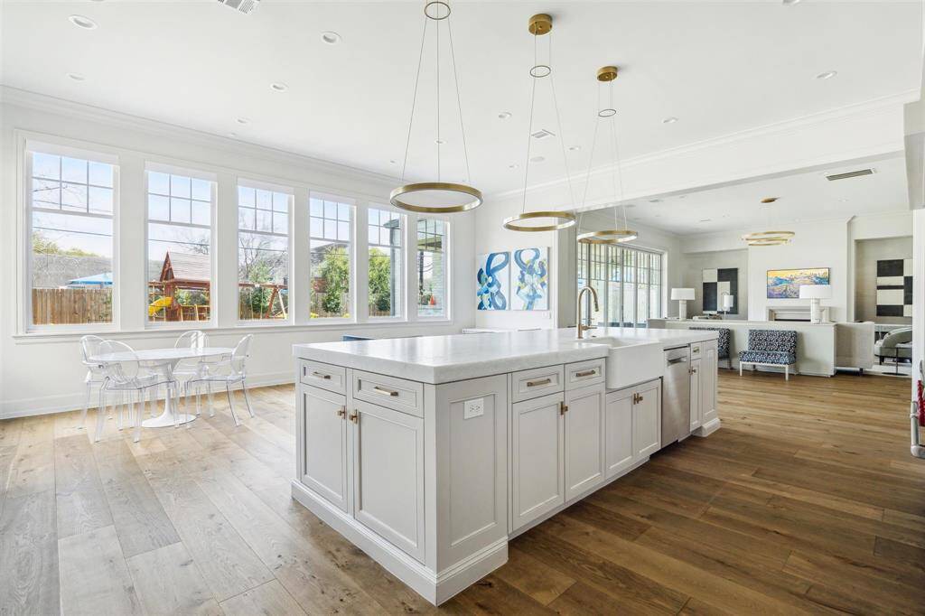 Bathed in natural light, this home boasts expansive windows that frame picturesque views of the serene backyard. The open-concept design enhances the airy ambiance, seamlessly blending indoor and outdoor living while creating a bright and inviting atmosphere.