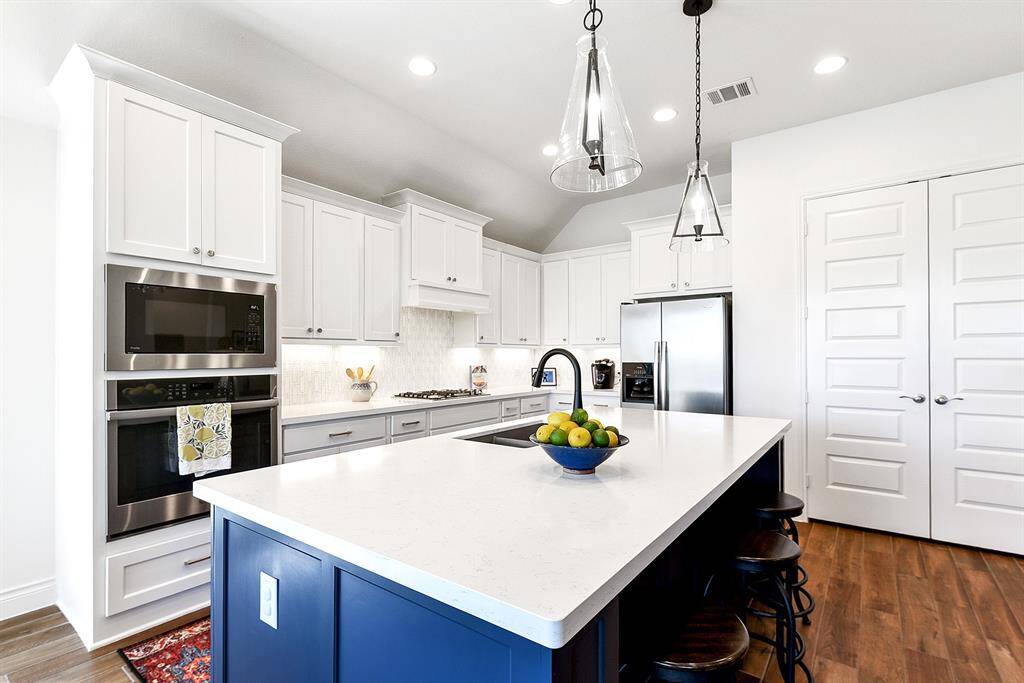 Another view of this island kitchen, offering an abundance of space and functionality.