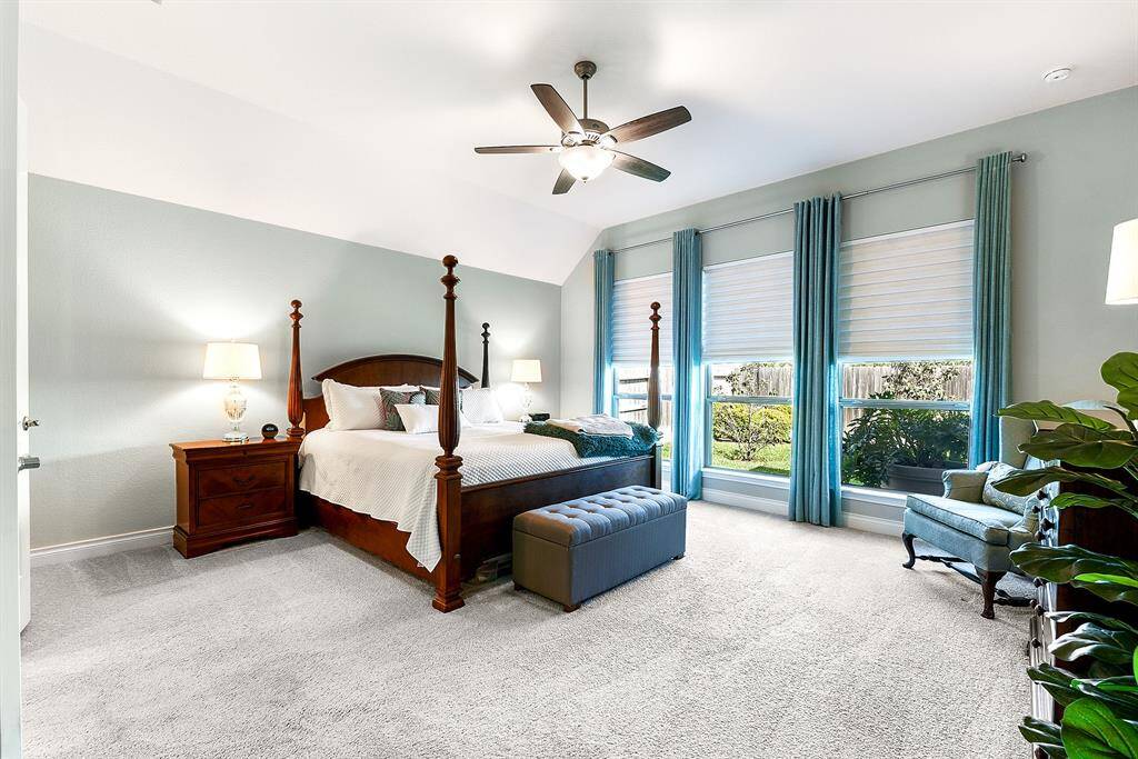 Another view showcasing the size of this luxurious ensuite bedroom, offering plenty of space to accommodate a seating.