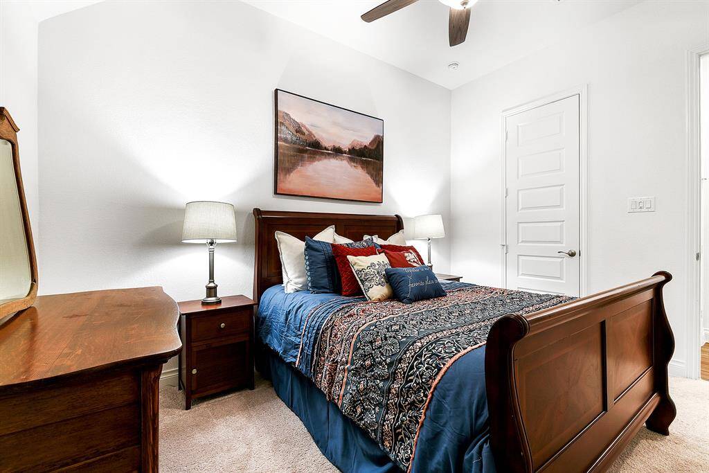 Another view showcasing the generous size of this guest bedroom.