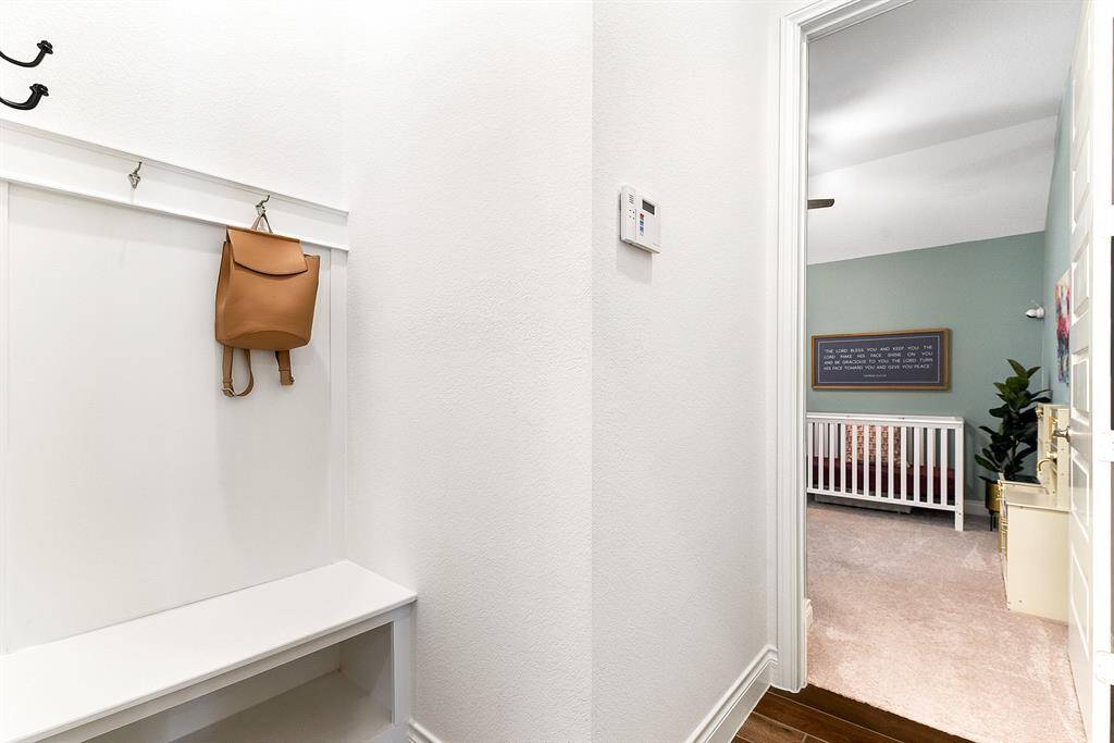 A great mud area off the garage features built-in storage, perfect for organizing shoes, coats, and other essentials.