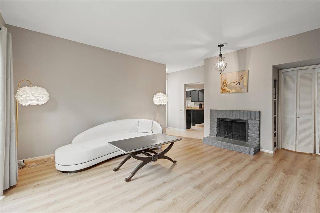 The overall design balances comfort and practicality, offering plenty of room for relaxation or entertaining. The recently updated laminate flooring enhances the space with a fresh, modern look while ensuring durability and easy maintenance.