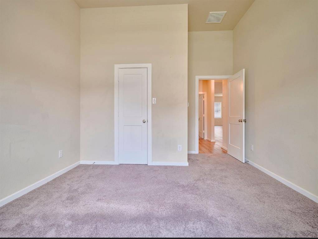 Spacious bedroom with Craftsman-style Monroe panel doors, ideal for comfort and personal touches.