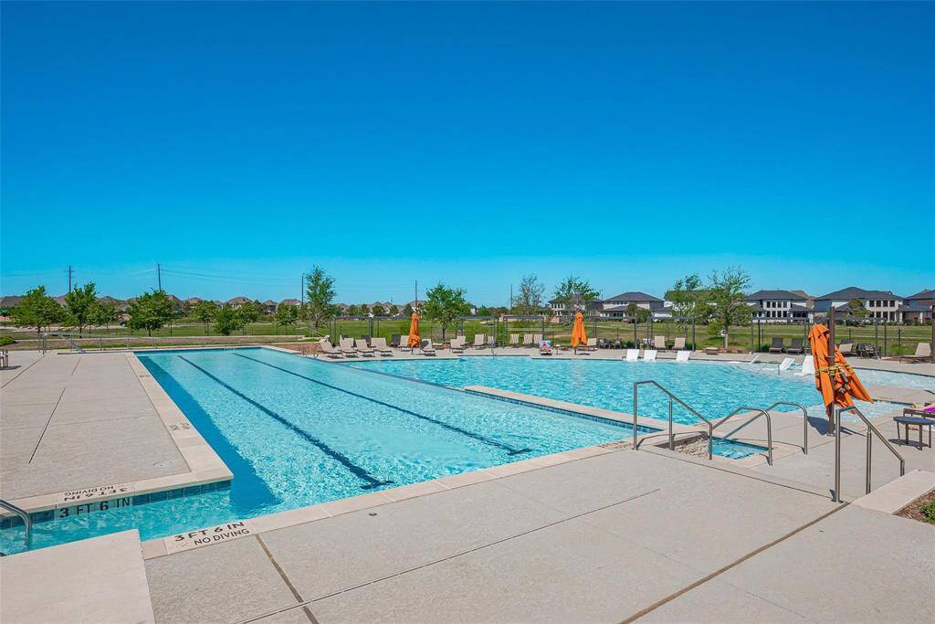 njoy relaxing and socializing at the inviting community pool, perfect for sunny days.