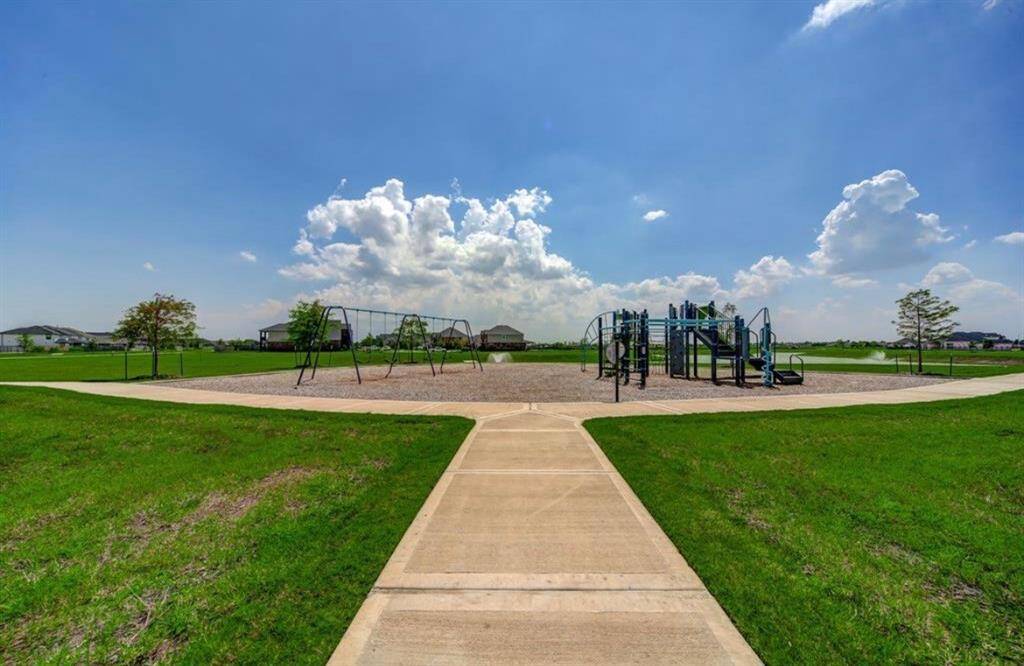 This is the neighborhood where your kids learn to ride their bikes, where your dog actually enjoys his walks, and where you might find yourself laughing with friends under the picnic pavilion on a Tuesday night, just because life is good.