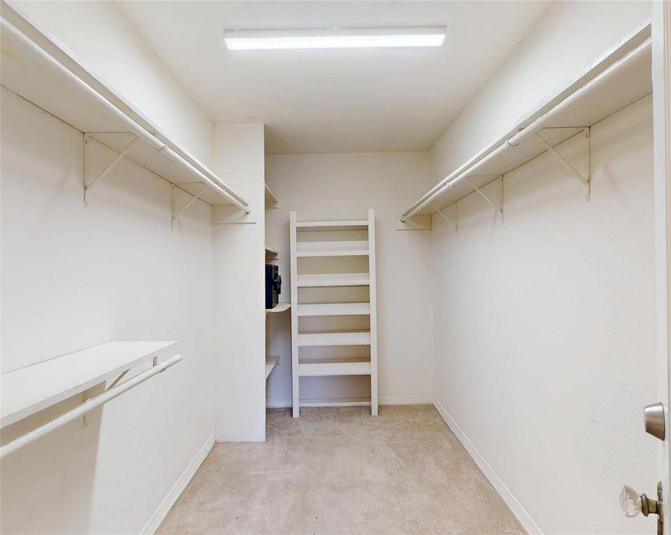 Walk-in closet in the primary bedroom.