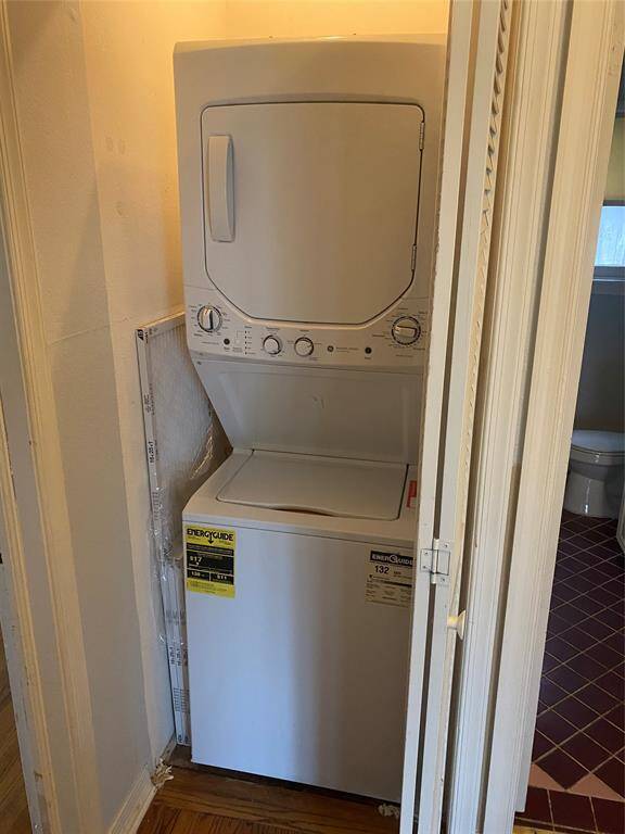 Stackable washer and dryer inside the house.