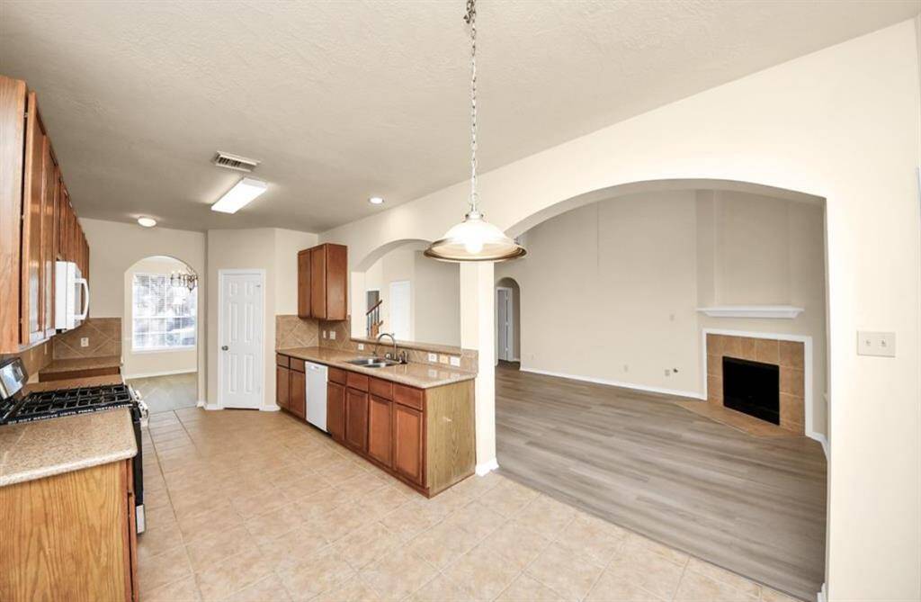 Kitchen opening to formal living