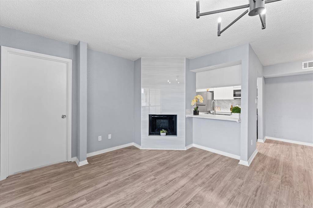 The custom fireplace is stunning with floor to ceiling tile and is a focal point of the room.
