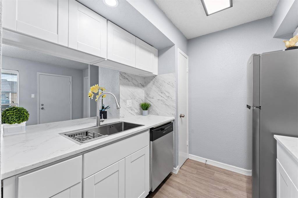 The kitchen boasts a new modern sink and faucet.