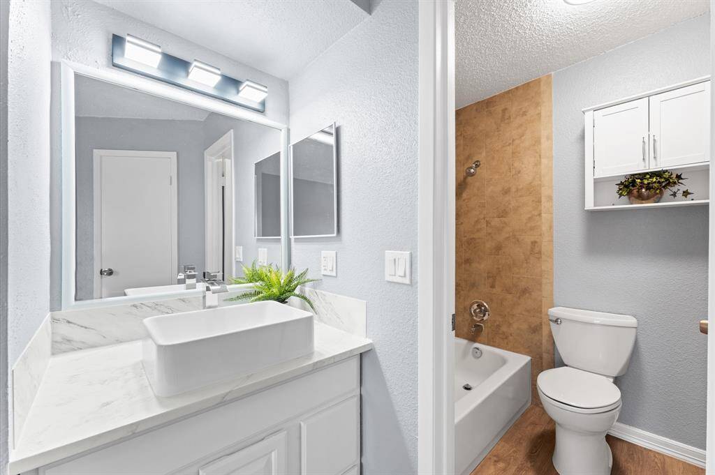 Primary bath with new vanity and large top mounted sink.