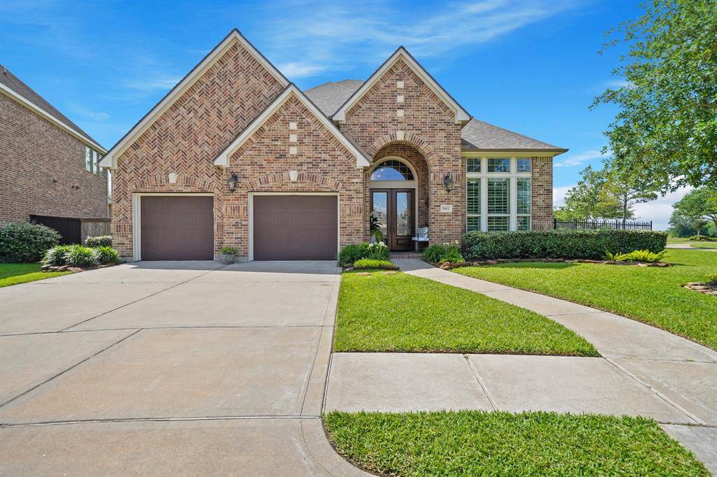 This stunning 2 story home offers lake views from almost every room and a double wide driveway with 3 car garage.
