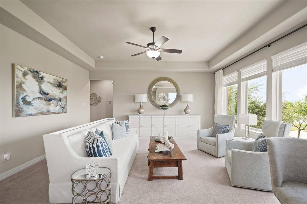 Upstairs, this spacious game room filled with natural light overlooks the sparkling lakes.