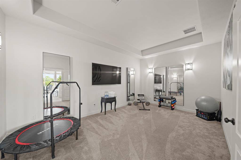 This media room/flex space is located just off of the game room.  Currently being used as an exercise room.