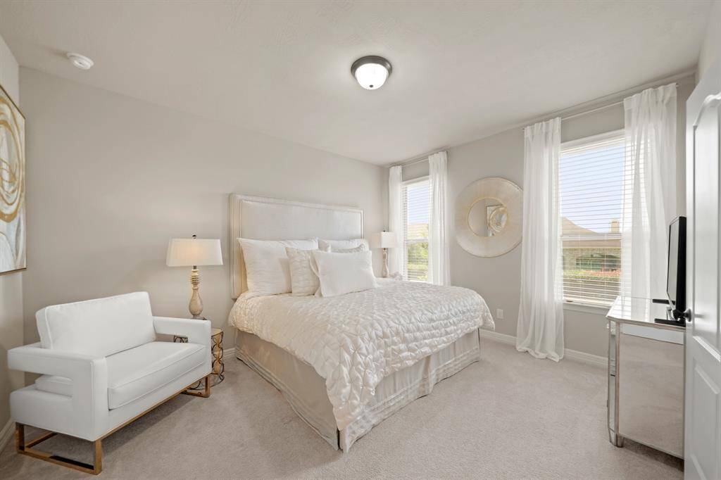 Bedroom #4.  All bedrooms offer walk-in closets.