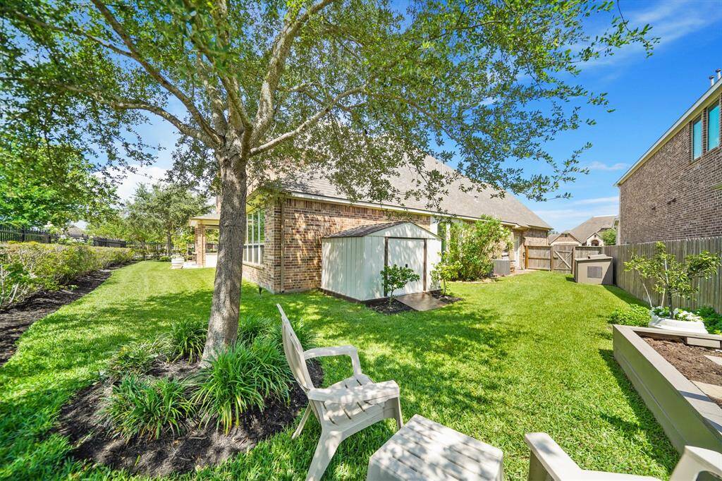 The spacious lot affords plenty of space.....a raised garden, storage shed and a generator storage building are included (generator not included).  The home has been updated to include an easy access for a generator.