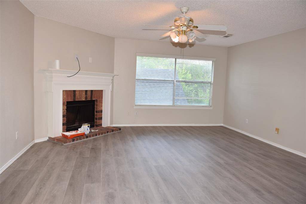 Hughe game room with fireplace