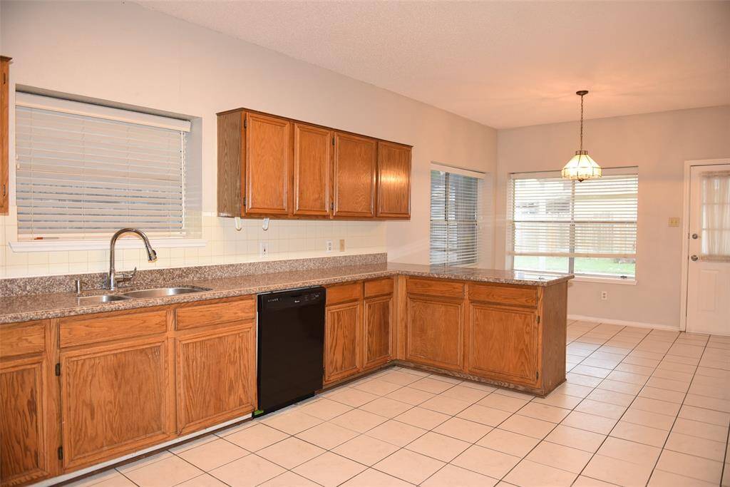 open kitchen with granite counter top
