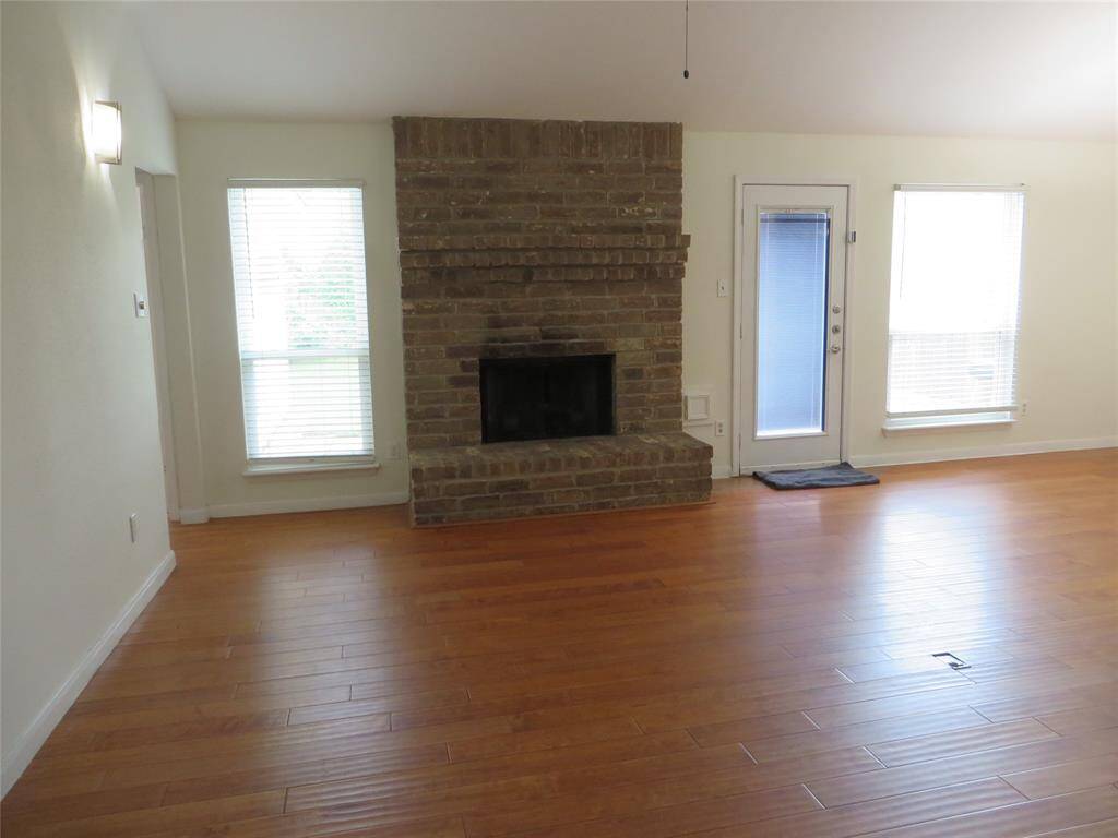Engineering wood flooring in spacious family room.