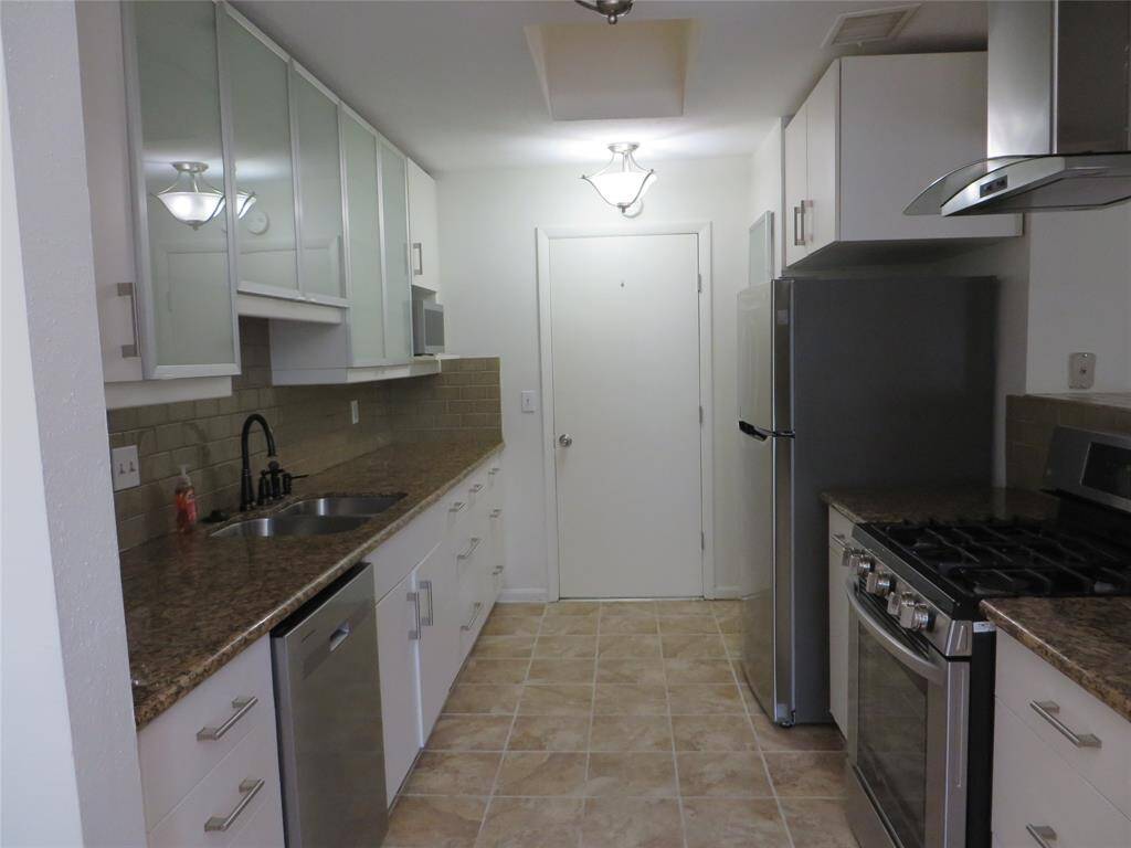 The kitchen features granite counters, new dishwasher, gas stove and cooktop. Stainless steel refrigerator is included.