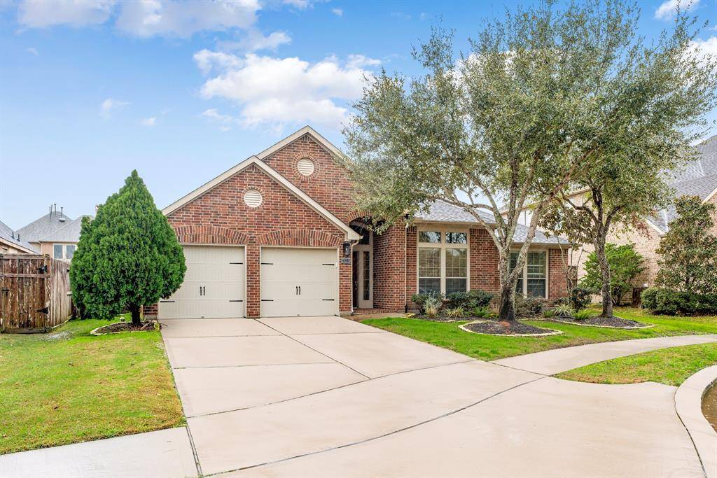 Nestled on a spacious Cul-de-sac lot, this inviting brick home boasts mature landscaping and a welcoming front entrance. The wide driveway and two-car garage offer convenience and ample parking.