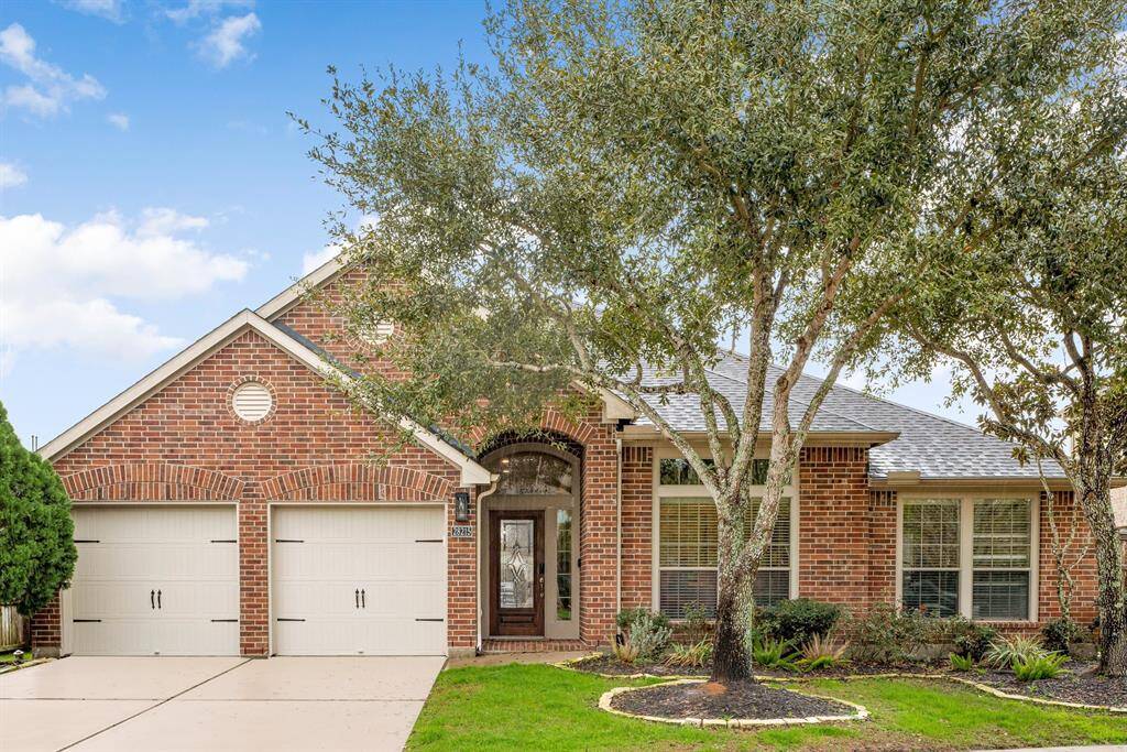 A beautifully maintained exterior pairs classic brick styling with charming landscaping, highlighted by mature trees. The home's covered entryway keeps you and your guest out of inclement weather while making your way inside.
