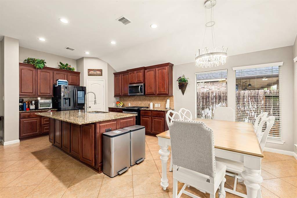 Enjoy a spacious kitchen and dining combo with stylish finishes and plenty of natural light.