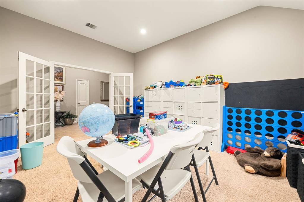 A flexible bonus room with French doors offers the perfect space for a second office, playroom, media room or creative studio.