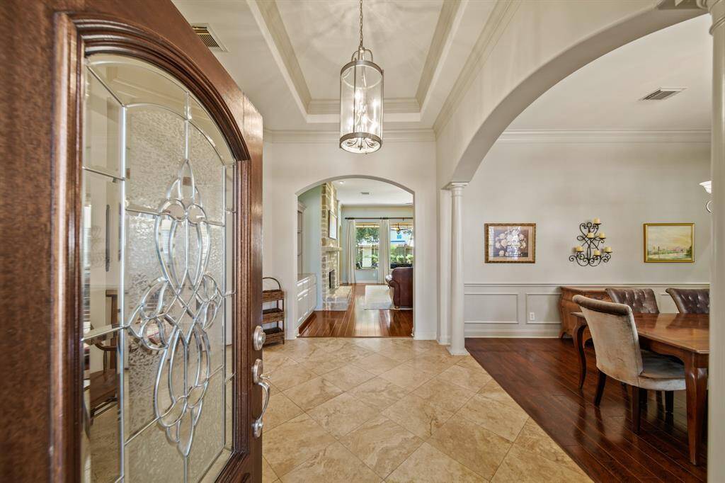Step into elegance through this stunning entrance, featuring polished tile flooring, graceful archways, and exquisite detailing that sets the tone for luxury living.